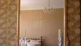 Home Reflections: Enhancing Interiors with Arched Gold Mirrors  